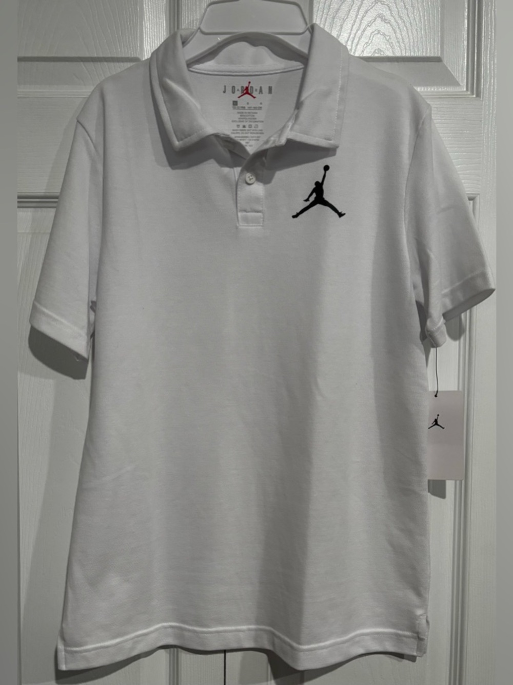 Boys Jordan White Polo with Black Jumpman Embroidered Logo. Size: L. NWT!